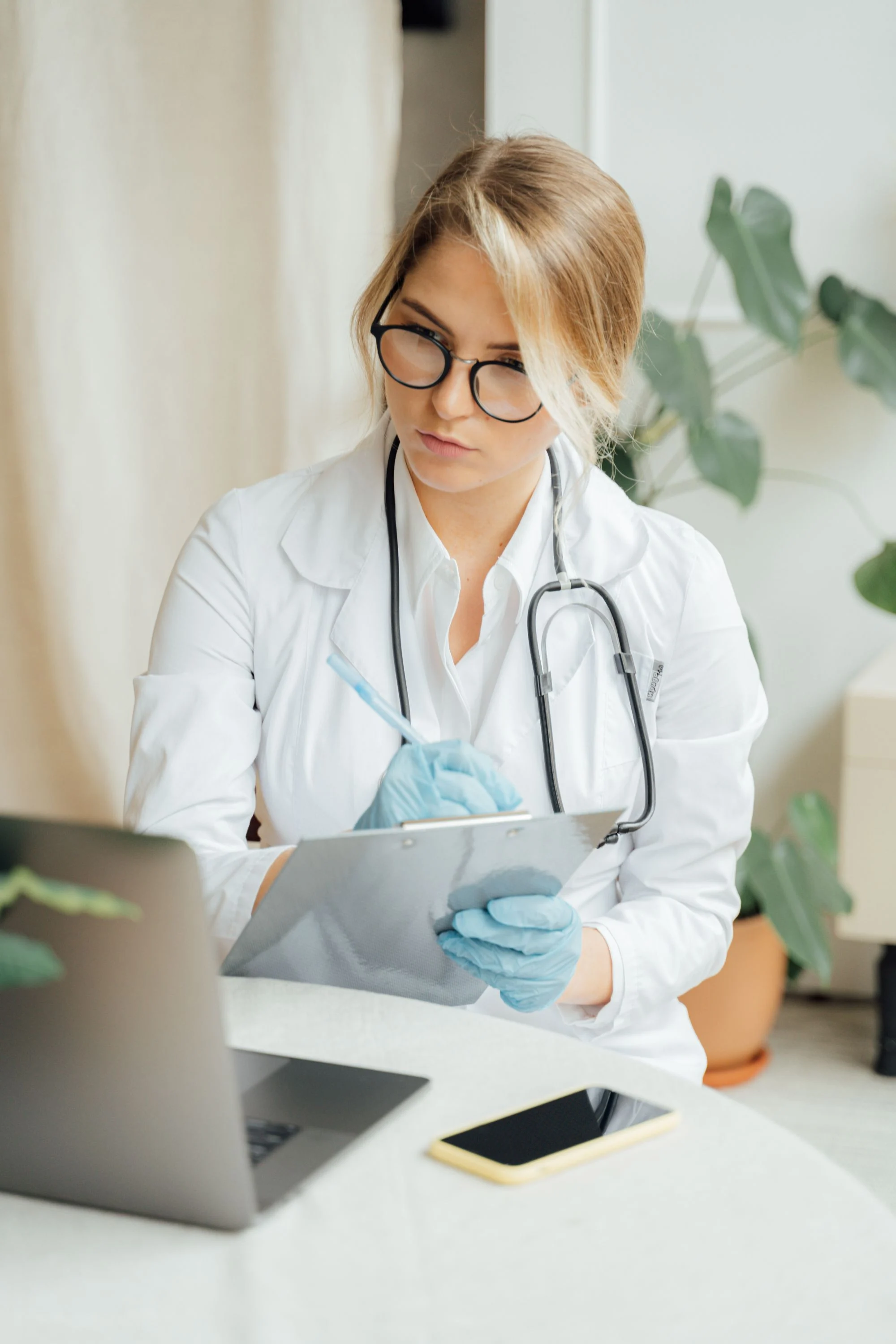 Doctor taking consultation notes